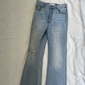 light blue jean pants with wide boots from Stradivarius brand